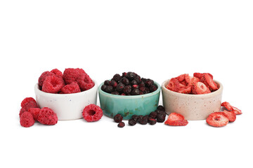 Bowls with tasty freeze-dried fruits on white background