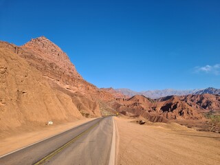 Asphalted highway in the mountainous and desert region of Quebrada de Las Conchas