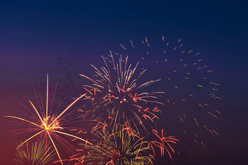 Colorful fireworks on night sky background.