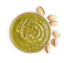 Tasty pistachio paste in bowl on white background
