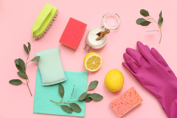 Composition with natural cleaning products and supplies on pink background