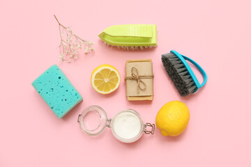 Composition with natural cleaning supplies on pink background