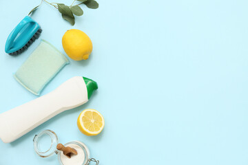 Composition with natural cleaning products, brush and sponge on color background