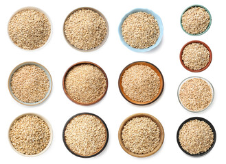 Set of pearl barley groats in bowls on white background, top view