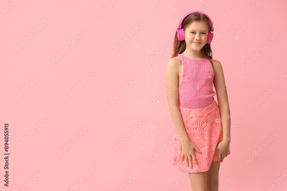 Sticker Cute girl in headphones with soap bubbles on pink background