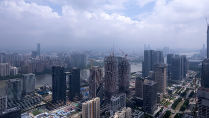 Aerial View of a Modern Urban Cityscape Under Cloudy Skies