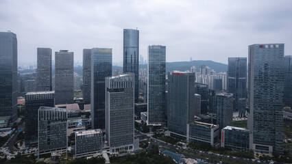 Aerial View of Modern Urban Skyline with Skyscrapers Under Cloudy Sky