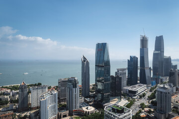 Fototapeta premium A Vibrant City Skyline Overlooking the Sea and Urban Life