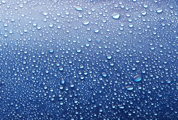 Water Droplets on Blue Glass Surface