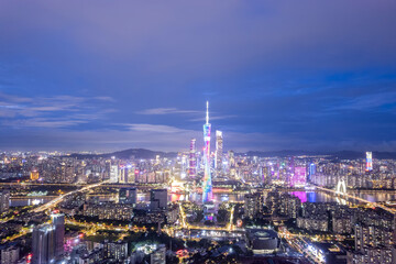 Vibrant Night Skyline of a Modern City Illuminated by Colorful Lights