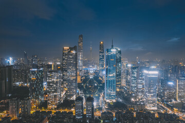 Obraz premium Stunning Aerial View of a Vibrant City Skyline at Night