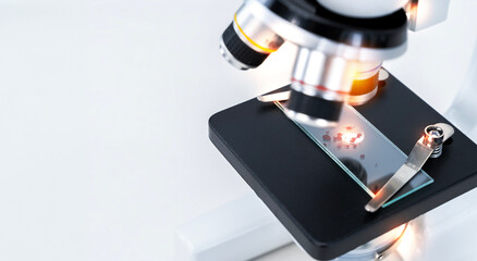 Medical laboratory, scientist hands using microscope for chemistry test samples.
