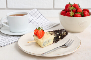 Plate with tasty cheesecake pop on light table