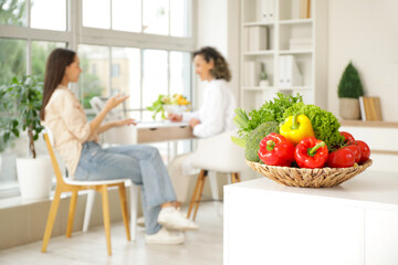 Plate with healthy vegetables on table in nutritionist's office, closeup