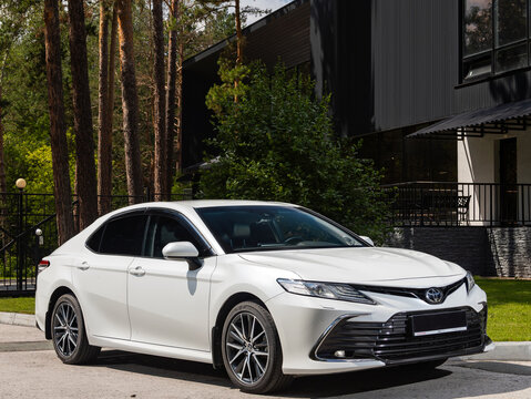 Novosibirsk, Russia -  July 10, 2024: Toyota Camry  parked in city. No other car and people.