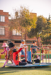 vertical vertical very happy children having fun in an outdoor park in latin america bolivia -...