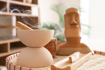Bowl with Palo Santo on table in living room, closeup