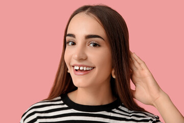 Fototapeta premium Young woman with diastema smiling on pink background, closeup