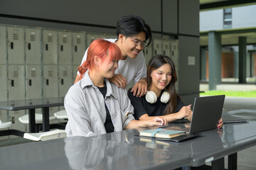 Group of Happy Students Studying Together with Laptop in Modern School Campus