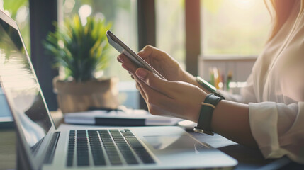 businesswoman's hand using a mobile smartphone, highlighting modern communication and technology's role in professional life and productivity