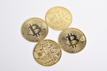 Bitcoin isolated on white background. Cryptocurrency. Golden bitcoin physical gold coin. Symbol of the crypto currency