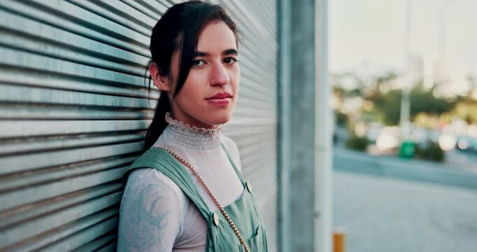 Face, travel and woman in a city street for career opportunity, experience or goals on garage background. Urban, portrait and ambitious female fashion student in New York for immigration or new start