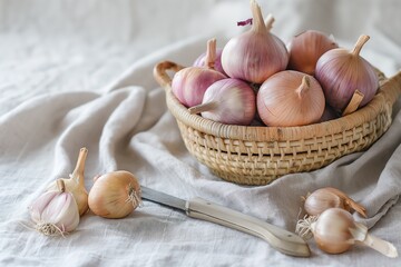 Photo of Shallots in Small Woven Basket with Silver Knife