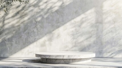 Marble Podium Against a White Wall With Sunlight and Shadows