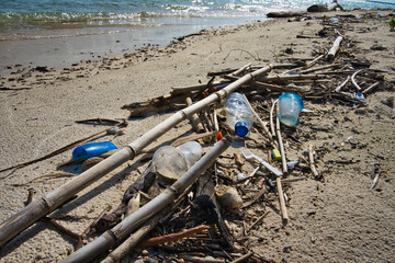 A stunning beach on Sumatra, overshadowed by the reality of modern pollution. The contrast of natural beauty with discarded plastics highlights the urgent need for environmental conservation.