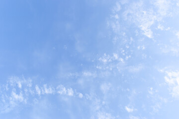 beautiful blue sky and white fluffy group of clouds with sunrise in the morning, natural background