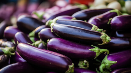 Explore vibrant market stalls adorned with fresh eggplants, their deep purple hues inviting you to create delicious dishes.