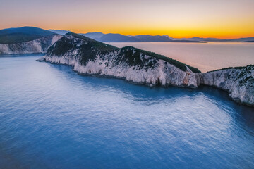 Lighthouse on the cliff. Seascape of Cape Lefkatas with old lighthouse on Lefkada island, Greece....