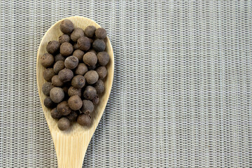 Jamaica pepper on white background, traditional spices. allspice close-up. selective focus,...