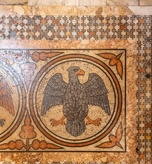 Mosaic with eagle on the floor of San Marco basilica in Venice