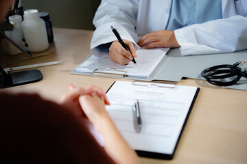Doctor with patient consultation in medical office. Visiting Physician concept