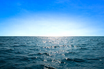 Fototapeta premium Ocean sea background and the clear sky For summer vacation ideas Nature of summer sea water with sunlight The sea sparkles against the blue sky