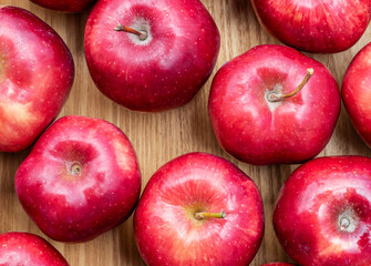 Top view red apple pattern on wooden floor