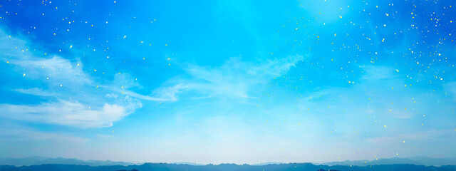 夜の幻想的な青空にキラキラと舞う金箔と大自然の山並み