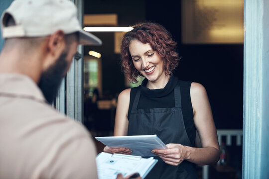 Business delivery, woman and package at front door for online shopping order, parcel distribution or ecommerce. Logistics man, customer and happy for product export, mail shipping and courier service