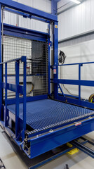 Fototapeta premium An industrial freight elevator platform used for handling cargo or manned operations during construction