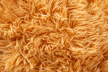 teddy bear toy fluffy structure close up, brown abstract backdrop texture