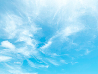 Blue sky background and white clouds soft focus, and copy space