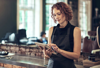 Tablet, salon and woman checking email for online schedule, booking or agenda for small business...