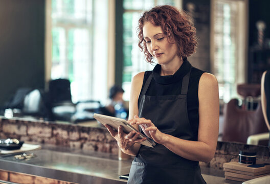 Tablet, salon and woman checking email for online schedule, booking or agenda for small business plan. Search, scroll and hairdresser with digital app for research, erp report or social media review