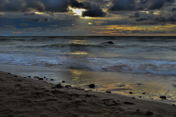 sunset over the  Baltic sea, cloudly sky