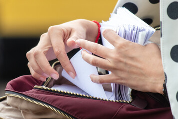 Business lady with paper documents in her hands. Close-up