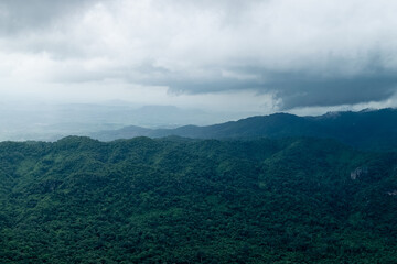 Mountain view with green forest in the rainy season.