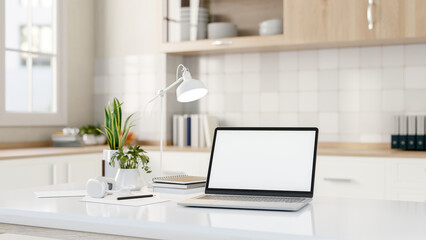 A laptop computer mockups on a modern white kitchen island in a minimalist white kitchen.