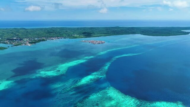 Aerial view of traditional stilt houses of bajo tribe on the water in  Wakatobi, Southeast Sulawesi, Indonesia