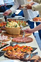 Guests are helping themselves at a catered event